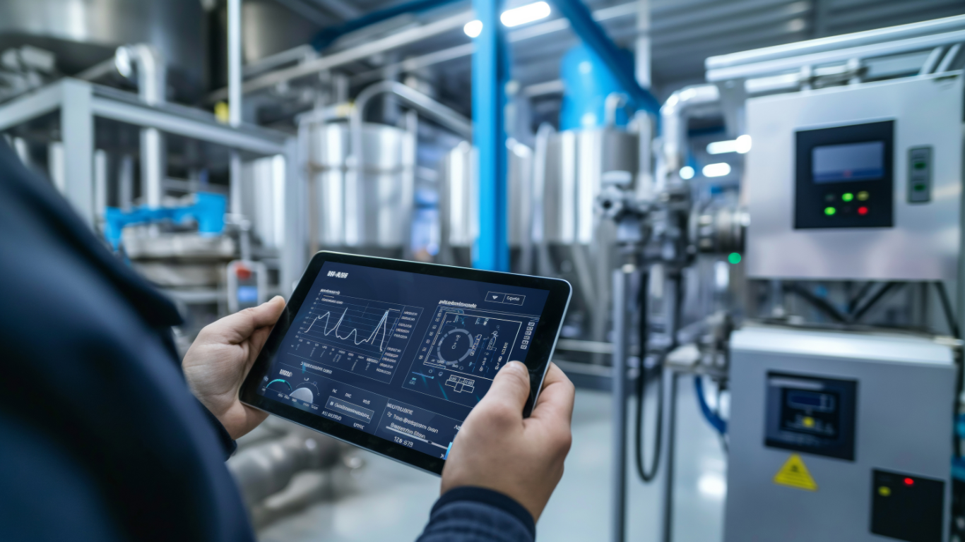 Representative image of a man working with a tablet and controlling the manufacturing process (Image by podgornaiaelena on Freepik)