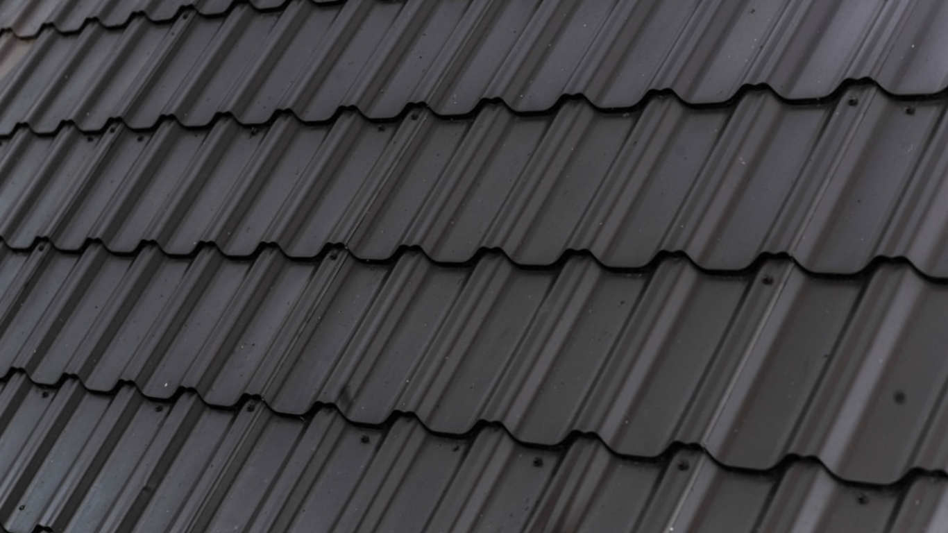 Benefits of Energy-Efficient Roofing for Businesses.https://unsplash.com/photos/a-close-up-of-a-roof-with-a-black-shinnel-BqhKviHBODM