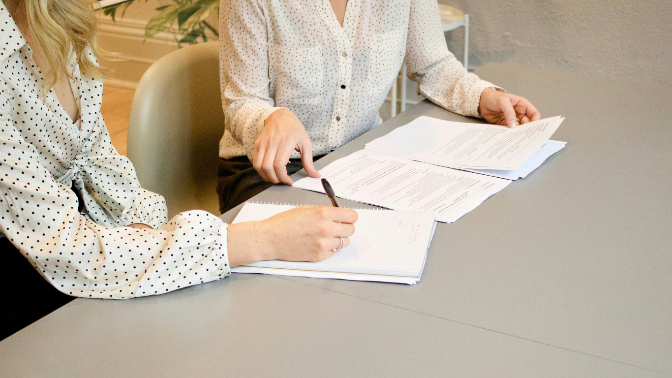 Essential Tax Insights Every Real Estate Investor Should Know. https://unsplash.com/photos/woman-signing-on-white-printer-paper-beside-woman-about-to-touch-the-documents-HJckKnwCXxQ