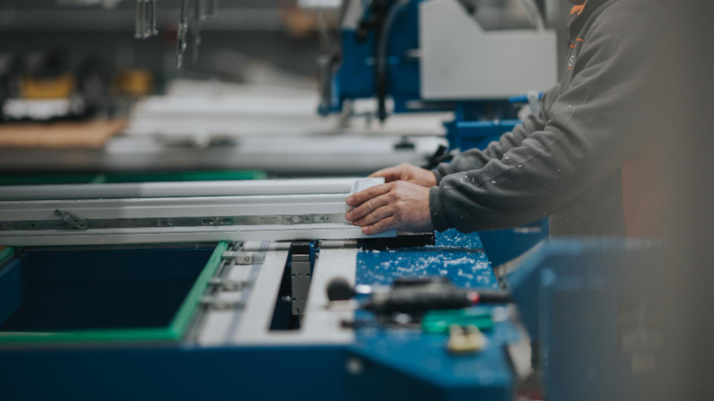Improving Assembly Quality with Precision-Cut Extrusions. https://www.freepik.com/premium-photo/midsection-manual-worker-making-window-frame-factory_106812741.htm#fromView=search&page=1&position=1&uuid=efd4628b-cca1-4436-908f-28874718e8cb&query=Improving+Assembly+Quality+with+Precision-Cut+Extrusions