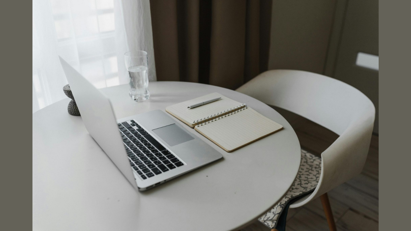 Essential Mailroom Management Products for Modern Businesses (Image credit: https://www.pexels.com/photo/laptop-and-notebook-on-top-of-a-round-table-5712537/)