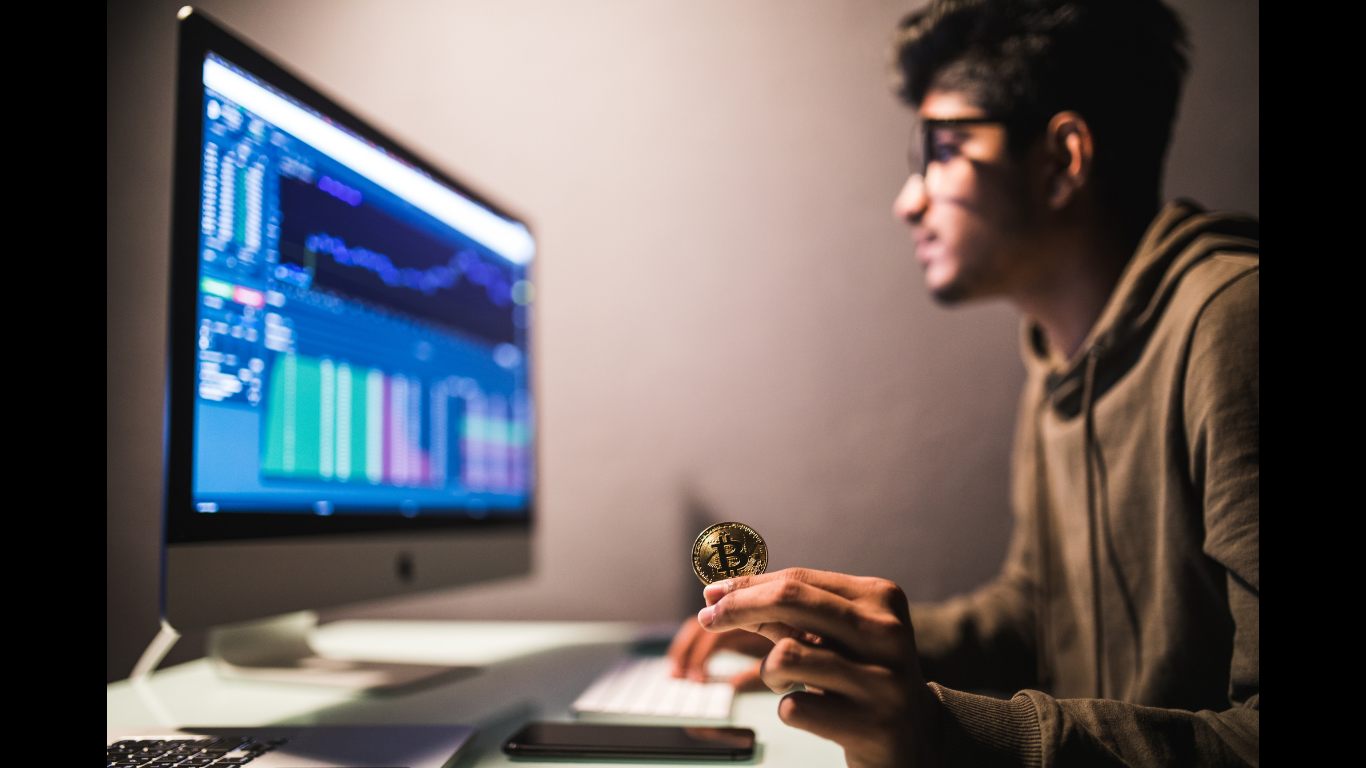Indian bitcoin trader checking stock trading data analysis concept-working office with financial graph computer monitors (Image credit: Freepik)