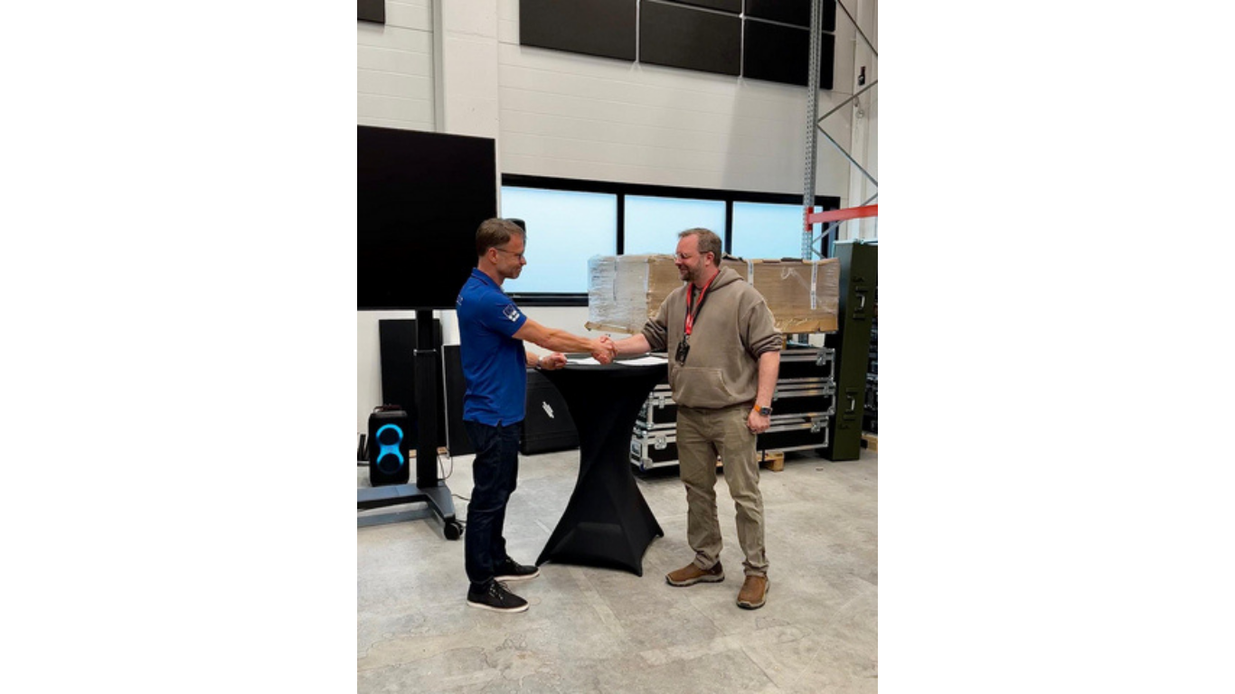 Anssi Rekula and Tuomas Rasila in the signing ceremony (Image credit: Business Wire)