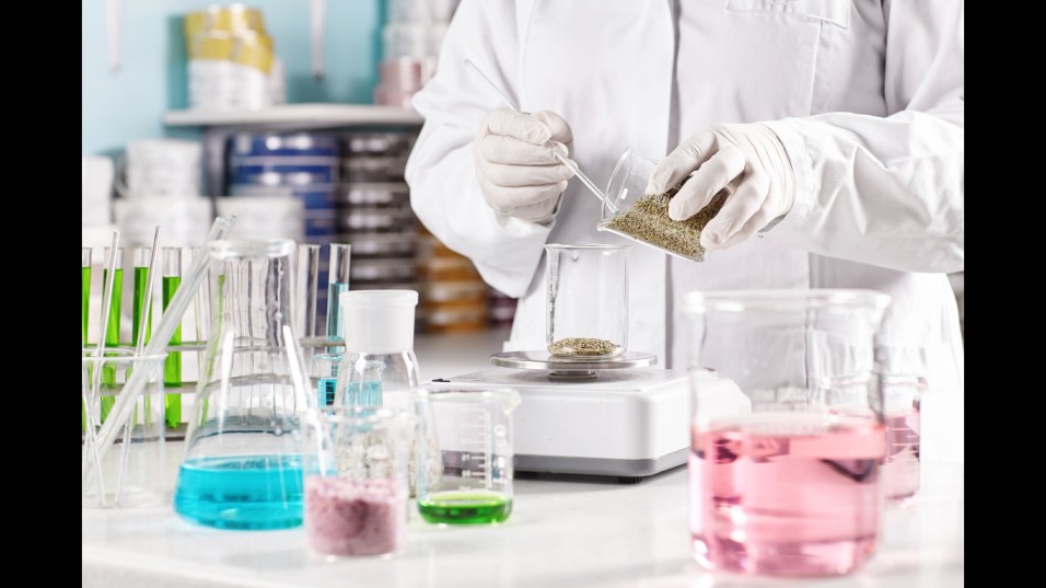 worker-surrounded-with-glass-beakers-filled-with-colorful-liquid (Image credit: Freepik)