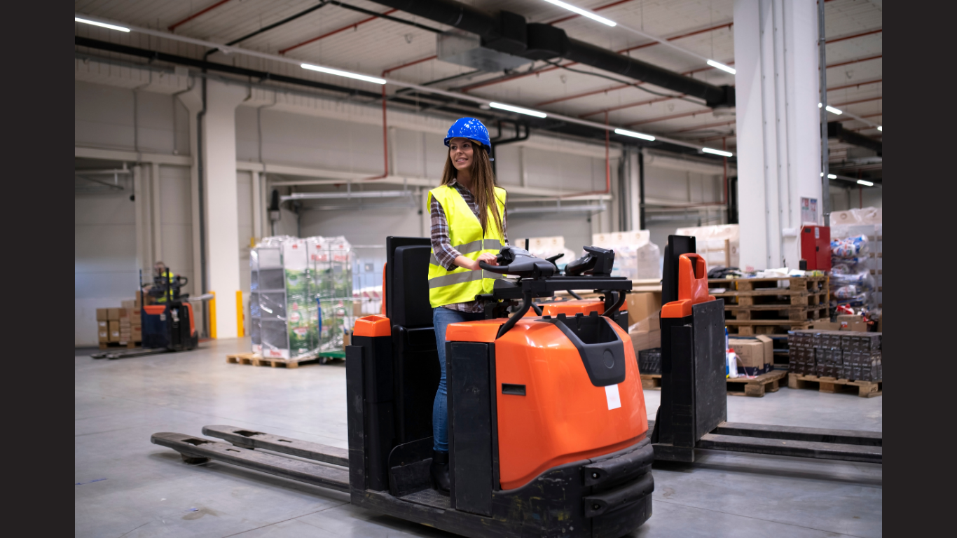 Factory worker in protective suit with hardhat driving forklift (Image credit: Magnific)