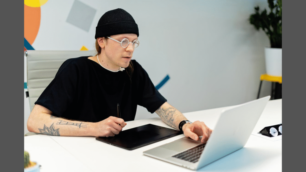 How AI Tools Are Simplifying Early-Stage Branding for Entrepreneurs. (Image source: https://www.pexels.com/photo/a-man-in-black-shirt-using-laptop-7989037/)
