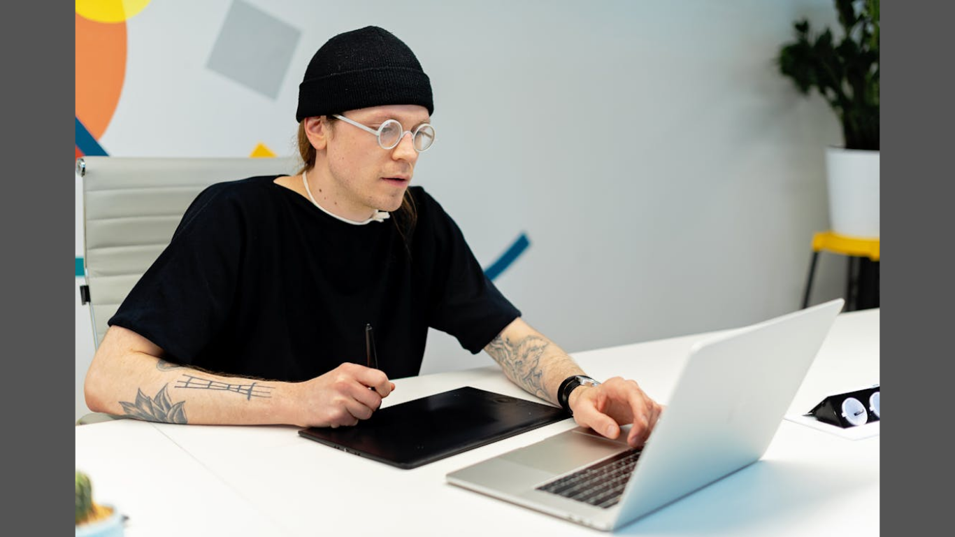 How AI Tools Are Simplifying Early-Stage Branding for Entrepreneurs. (Image source: https://www.pexels.com/photo/a-man-in-black-shirt-using-laptop-7989037/)