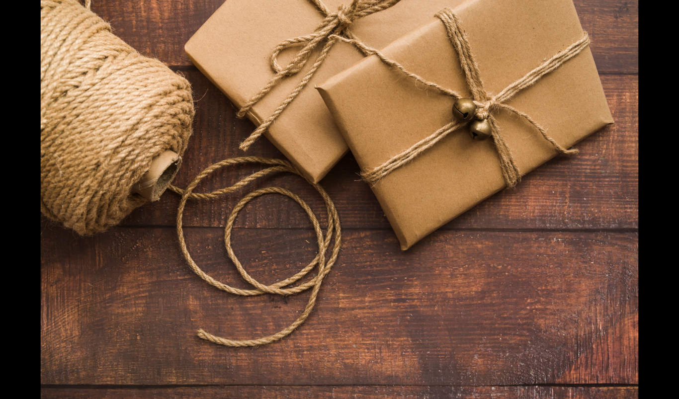 How to Choose Eco-Friendly Packaging for Your Business. (Credit: https://www.magnific.com/free-photo/gift-boxes-with-rope-table_3299668.htm)