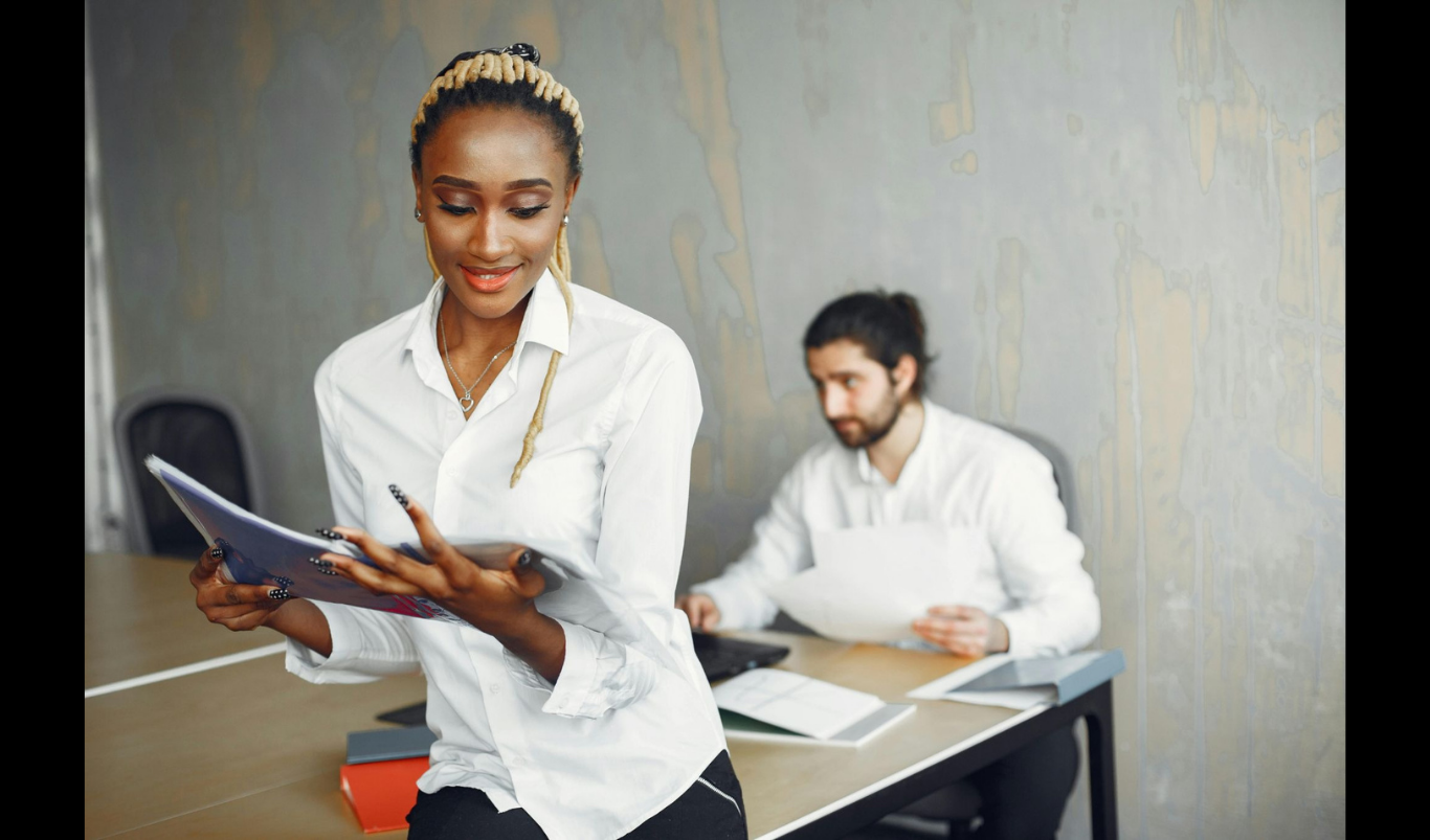 How Employee Recognition Programs Strengthen Business Performance and Workplace Culture. (Photo credit: https://www.pexels.com/photo/woman-in-white-dress-shirt-looking-at-a-document-7156254/)