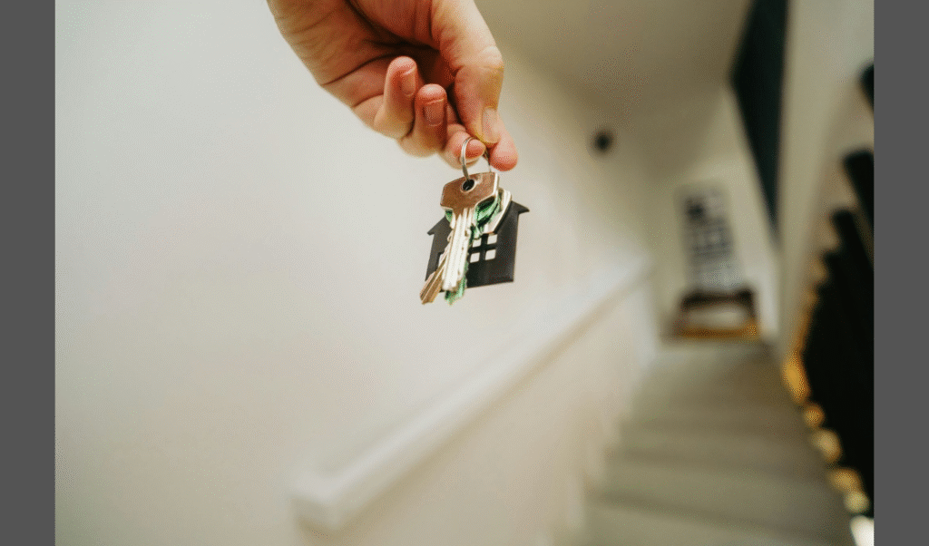 Financial Planning Tips Before Selling a House. (IMAGE SOURCE: https://unsplash.com/photos/a-person-holding-a-house-key-in-their-hand-Vg96IZTFubo)