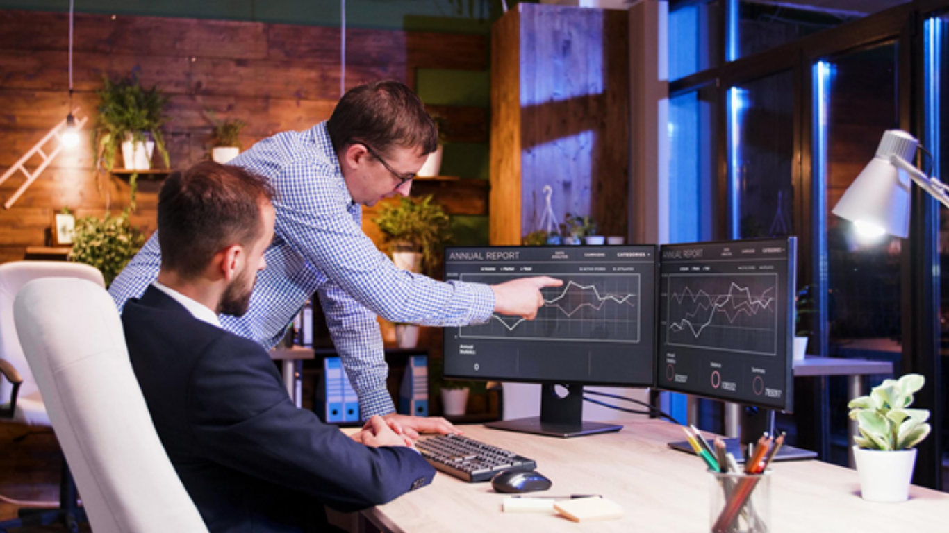 Cybersecurity, Compliance, and Uptime: What IT Priorities Actually Drive Business Growth. (Image credit: https://www.freepik.com/free-photo/business-colleagues-discussing-together-office-night-teamwork-partnership_22063602.htm)