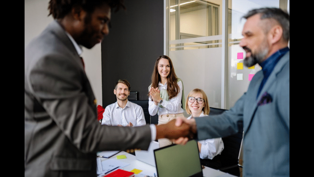 How to Design a High ROI Recognition Program. (Image credit: https://www.pexels.com/photo/colleagues-looking-at-men-in-an-agreement-7793706/)