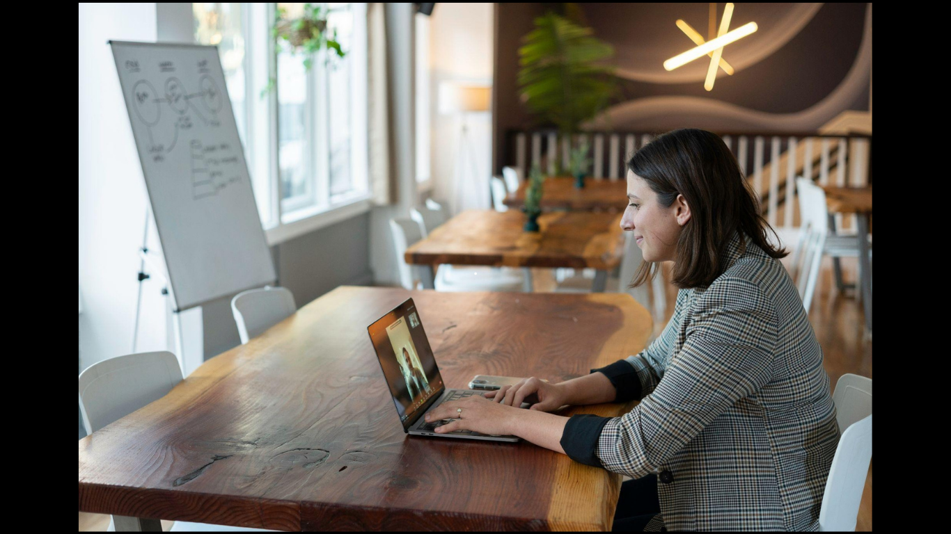 Essential Board Portal Features to Look For Before Choosing a Platform. (https://unsplash.com/photos/woman-in-gray-and-white-striped-long-sleeve-shirt-using-silver-macbook-VtKoSy_XzNU)