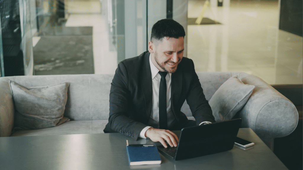 Four MBA Skills CFOs Need for the Gen AI Era. (Image source: https://www.pexels.com/photo/businessman-smiling-while-working-on-laptop-in-modern-office-36766661/)