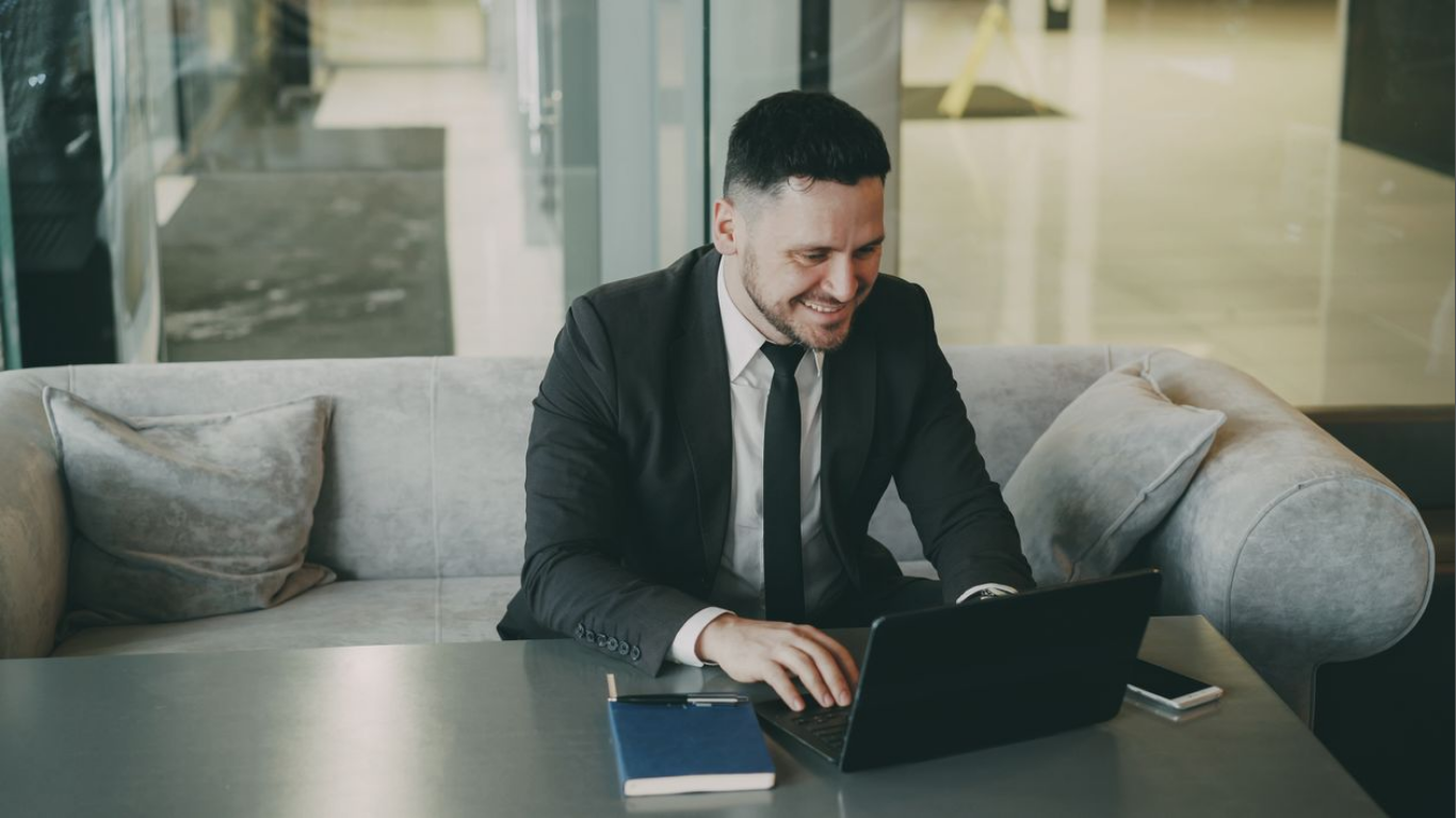 Four MBA Skills CFOs Need for the Gen AI Era. (Image source: https://www.pexels.com/photo/businessman-smiling-while-working-on-laptop-in-modern-office-36766661/)
