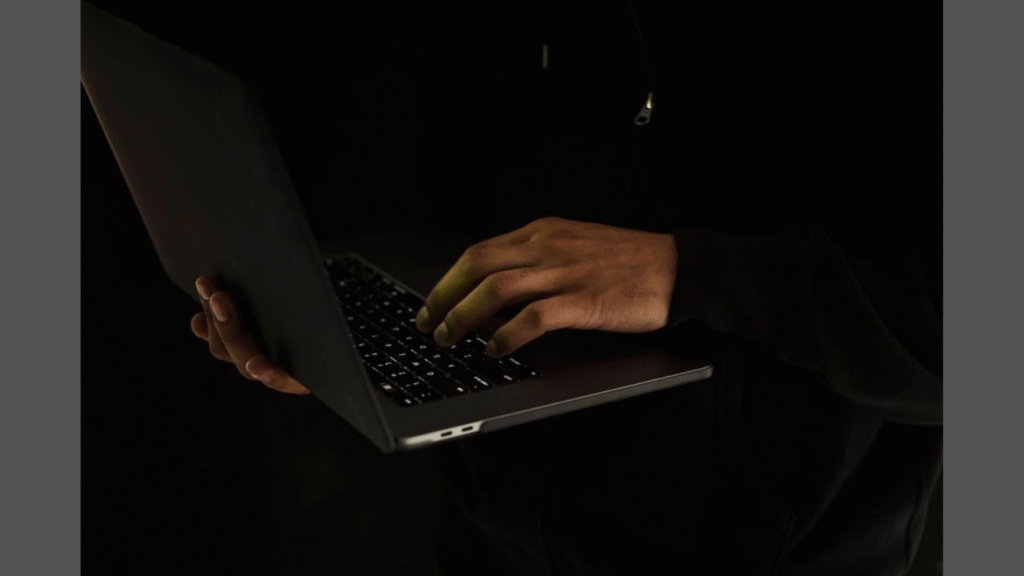 How to Start a Cybersecurity Career Without Pausing Work. (Image Credit: https://www.pexels.com/photo/crop-unrecognizable-man-using-laptop-in-darkness-5926397/)