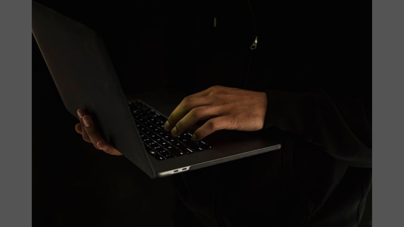 How to Start a Cybersecurity Career Without Pausing Work. (Image Credit: https://www.pexels.com/photo/crop-unrecognizable-man-using-laptop-in-darkness-5926397/)