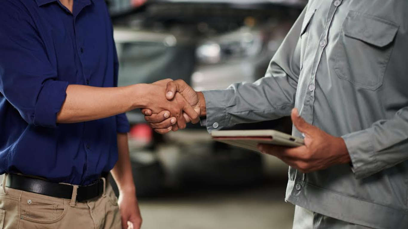 Repairify and Opus IVS Merge to Lead Automotive Diagnostics. https://www.magnific.com/premium-photo/mechanic-car-owner-shaking-hands-signing-document_63513541.htm#from_element=cross_selling__photo