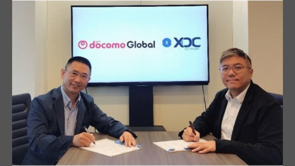 Noriyuki Kaya, Head of Service Operations Office, Digital Platform Service Business Division at NTT DOCOMO GLOBAL (left); Shanlong James Chen, Chief Partnerships Officer at XDC Network (right).(Image Credit: Business Wire)