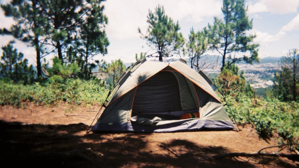Taking Team Building Outside the Office With a Camping Trip. ( IMAGE SOURCE: https://www.pexels.com/photo/tent-on-a-field-19178410/)