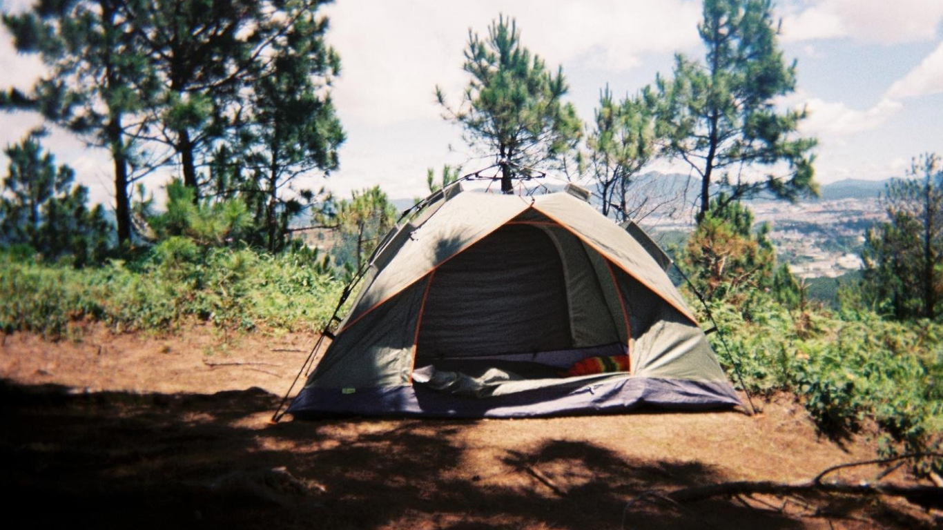 Taking Team Building Outside the Office With a Camping Trip. ( IMAGE SOURCE: https://www.pexels.com/photo/tent-on-a-field-19178410/)