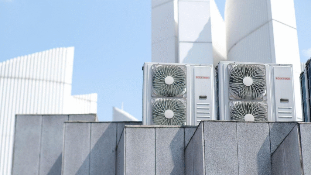 The Financial Impact of HVAC Efficiency on Assets. (IMAGE SOURCE: https://www.pexels.com/photo/modern-air-conditioner-units-on-urban-rooftop-38228166/)