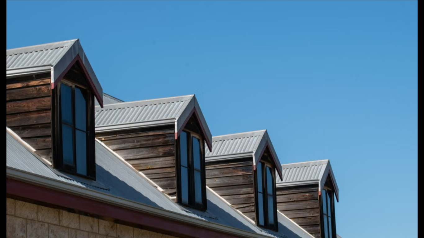 Commercial Roof Trends Transforming Real Estate Value. (IMAGE SOURCE: https://www.pexels.com/photo/triangular-rooftops-against-clear-sky-28999250/)