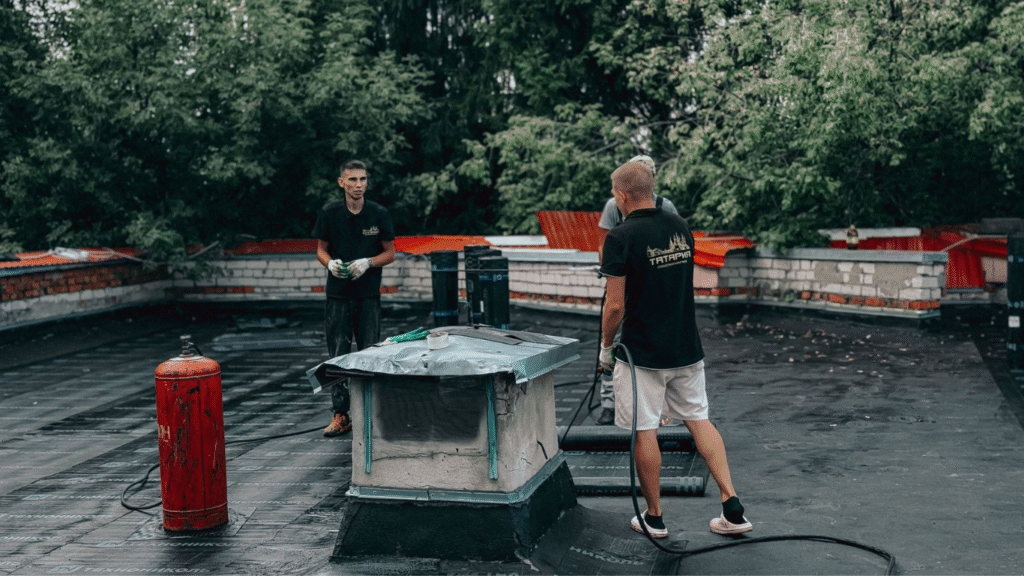 Commercial Roof Upgrades That Boost Property ROI. (Image Source: https://www.pexels.com/photo/roofing-professionals-conducting-maintenance-outdoor-39238333/)