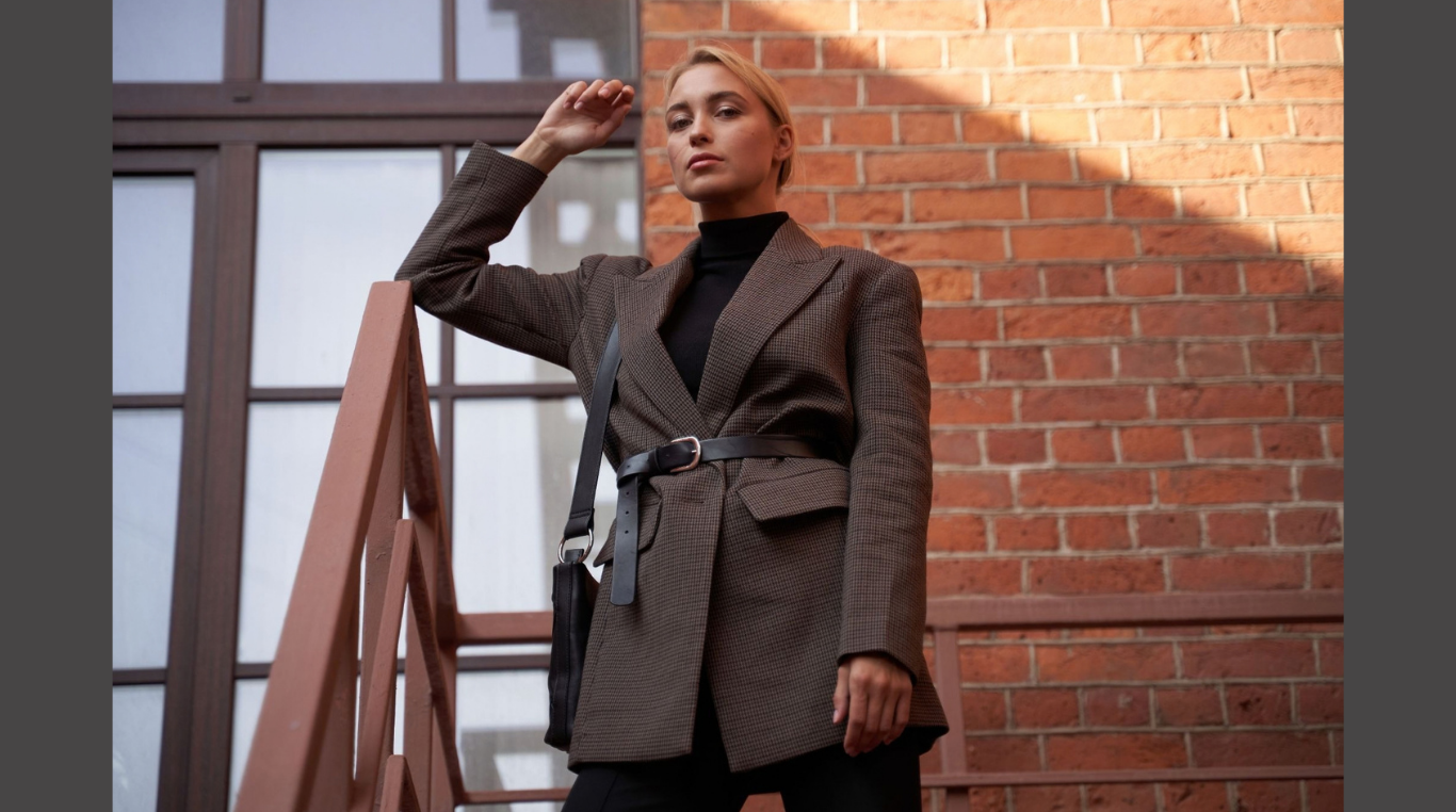 How to Dress to Impress at Your Next Business Function. (IMAGE SOURCE: https://www.pexels.com/photo/a-woman-in-brown-blazer-standing-beside-brown-brick-wall-5822228/)