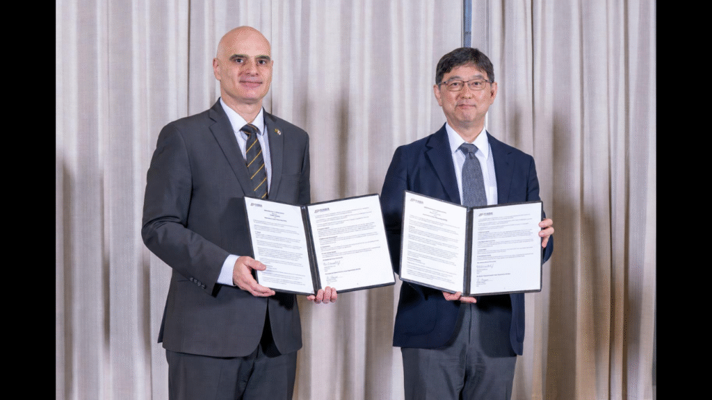Naoyuki Maekawa, Director-General, Innovation Department, JETRO (right), and Dimitrios Peroulis, Senior Vice President for Partnerships and Online, Purdue University (left), exchange the signed MOU at Purdue University in West Lafayette, Indiana, on September 9, 2026. The MOU was signed by JETRO Chairman and CEO Norihiko Ishiguro and Purdue University Interim President Mitchell E. Daniels, Jr. (Photo credit: Krock Photography, LLC)